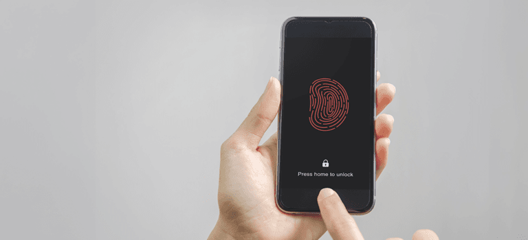 Hands holding a mobile phone using biometrics as two-factor authentication