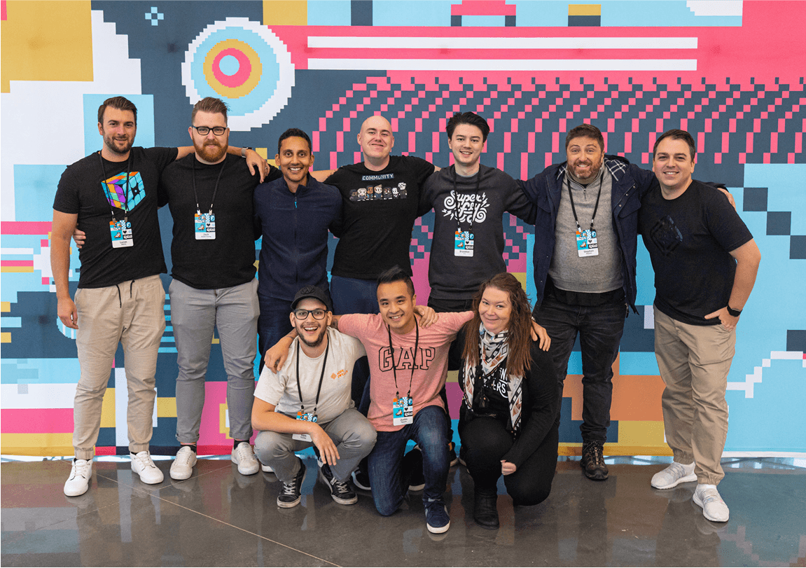 brisbane hub with people standing in front of a wall graphic